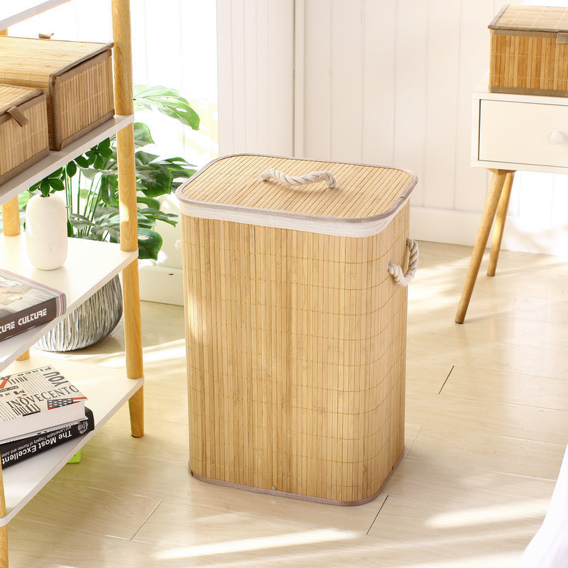 Sleek natural bamboo laundry hamper with closed lid in a contemporary living room