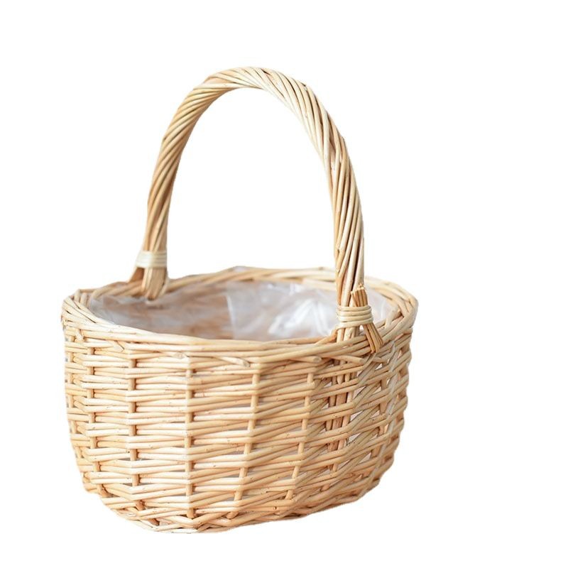 Our handwoven wicker basket with handle is crafted from natural rattan. This handwoven wicker basket features a sturdy handle for easy carrying. The handwoven rattan basket is ideal for fruit storage and gifting.