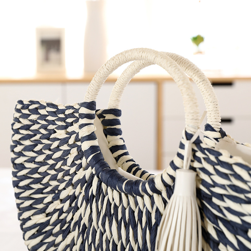 Top opening and double round handles of semicircular striped straw tote bag