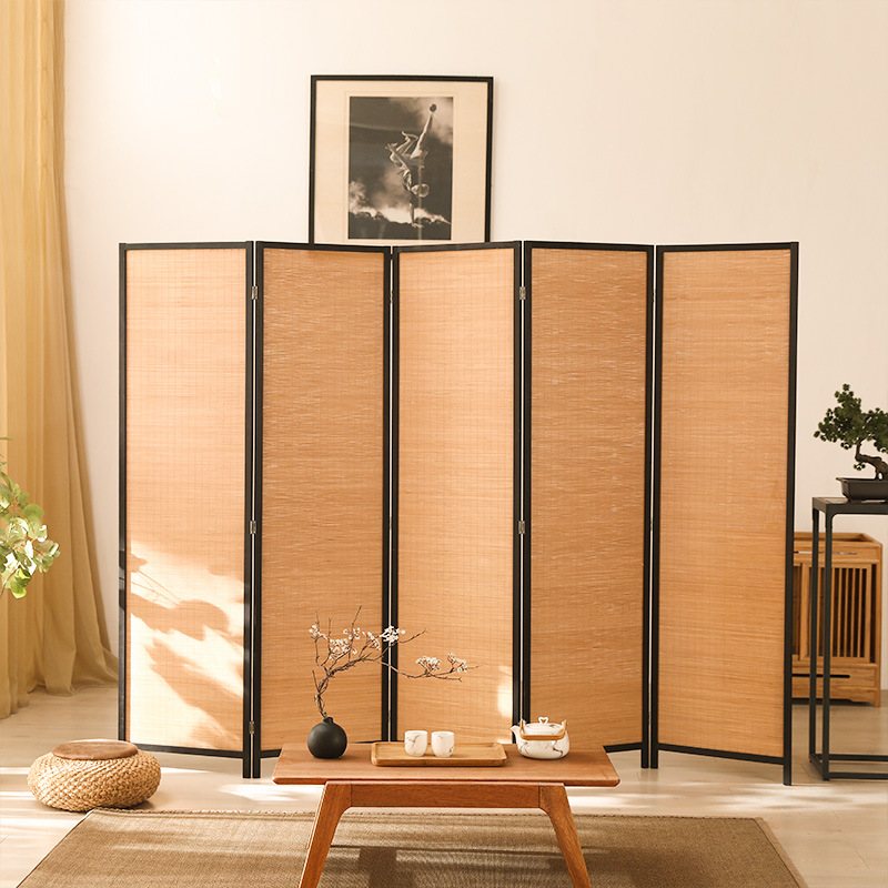 Close-up of the hand-woven bamboo panel and pine frame on a folding room divider