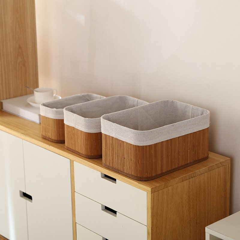 Three bamboo storage boxes in 30x20x12, 25x15x10 and 20x10x8 cm with lids