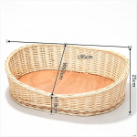 Willow woven pet bed in a living room setting with a cat resting inside