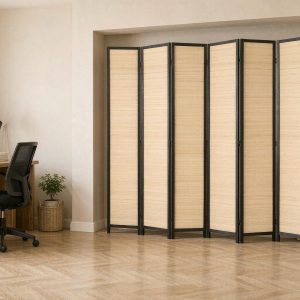 Dense bamboo weave screen separating a work from home desk corner from the rest of the room