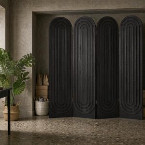 Carved arch panels screening an entryway storage niche beside a console and mirror