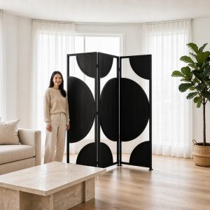 Circular wood inlays on black folding screen panels bringing sculptural character to a modern living room