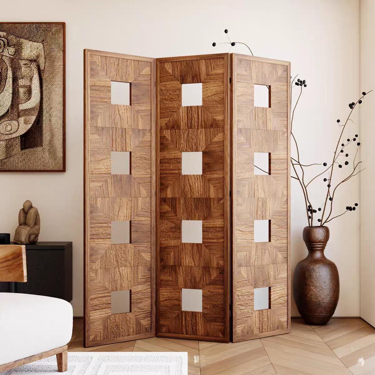 Chevron and diamond inlay wood screen in two walnut tones above a herringbone wood floor room