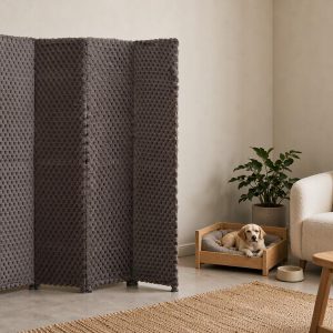 Grey loop weave fabric screen panels creating a pet corner with a wooden dog bed and chew toys