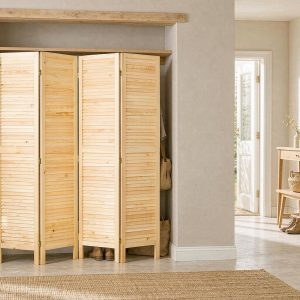 Ventilated louvered room divider panels closing an entryway closet with coats and shoes behind