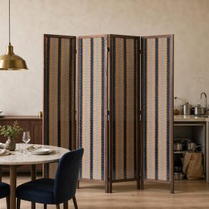 Navy and sand striped weave in a walnut frame screening an open kitchen from the dining table