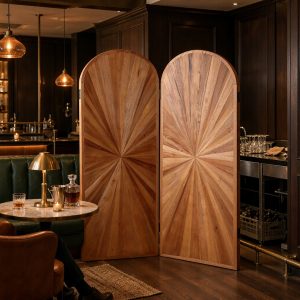 Radiating sunburst wood screen pattern dividing a whisky bar lounge with green banquettes
