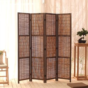 Woven reed screen in a bright living room beside sheer curtains, a bonsai and a rattan side table on wood floor